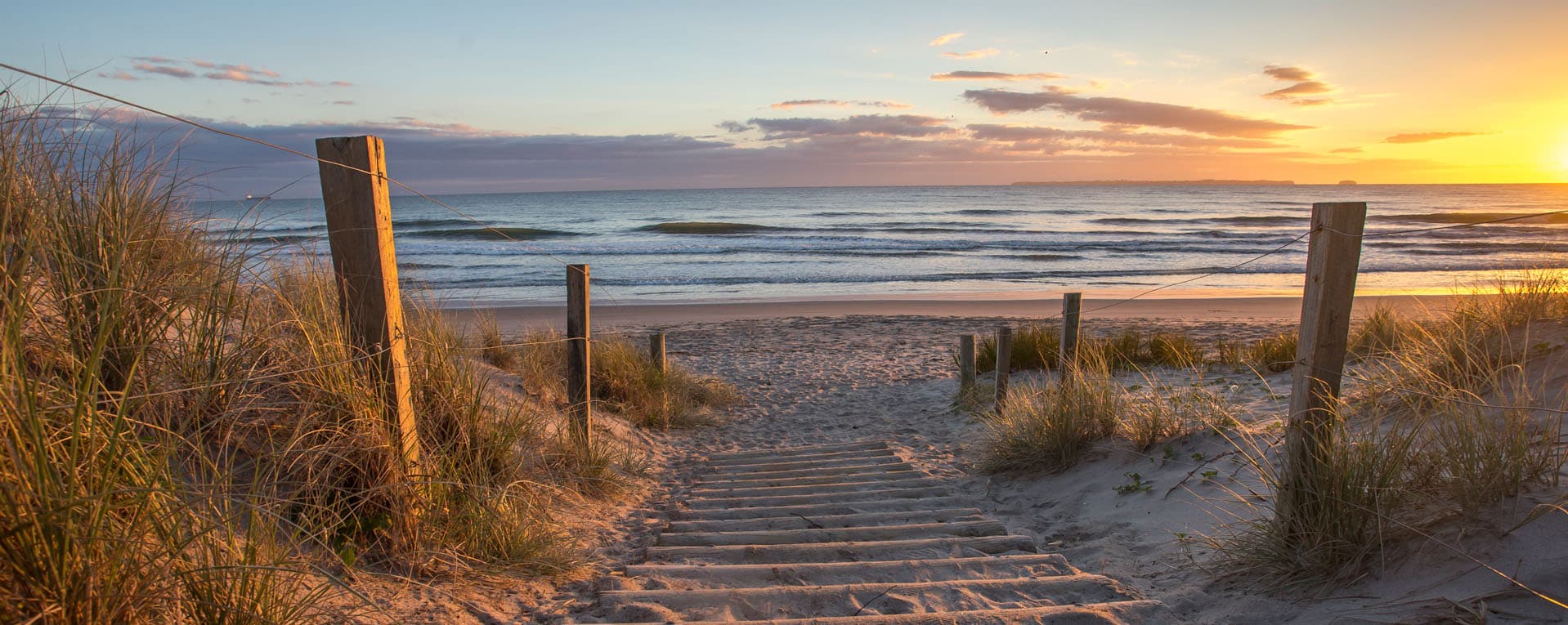Papamoa Beach pathway at sunset - peaceful coastal setting for counselling sessions in Tauranga, New Zealand