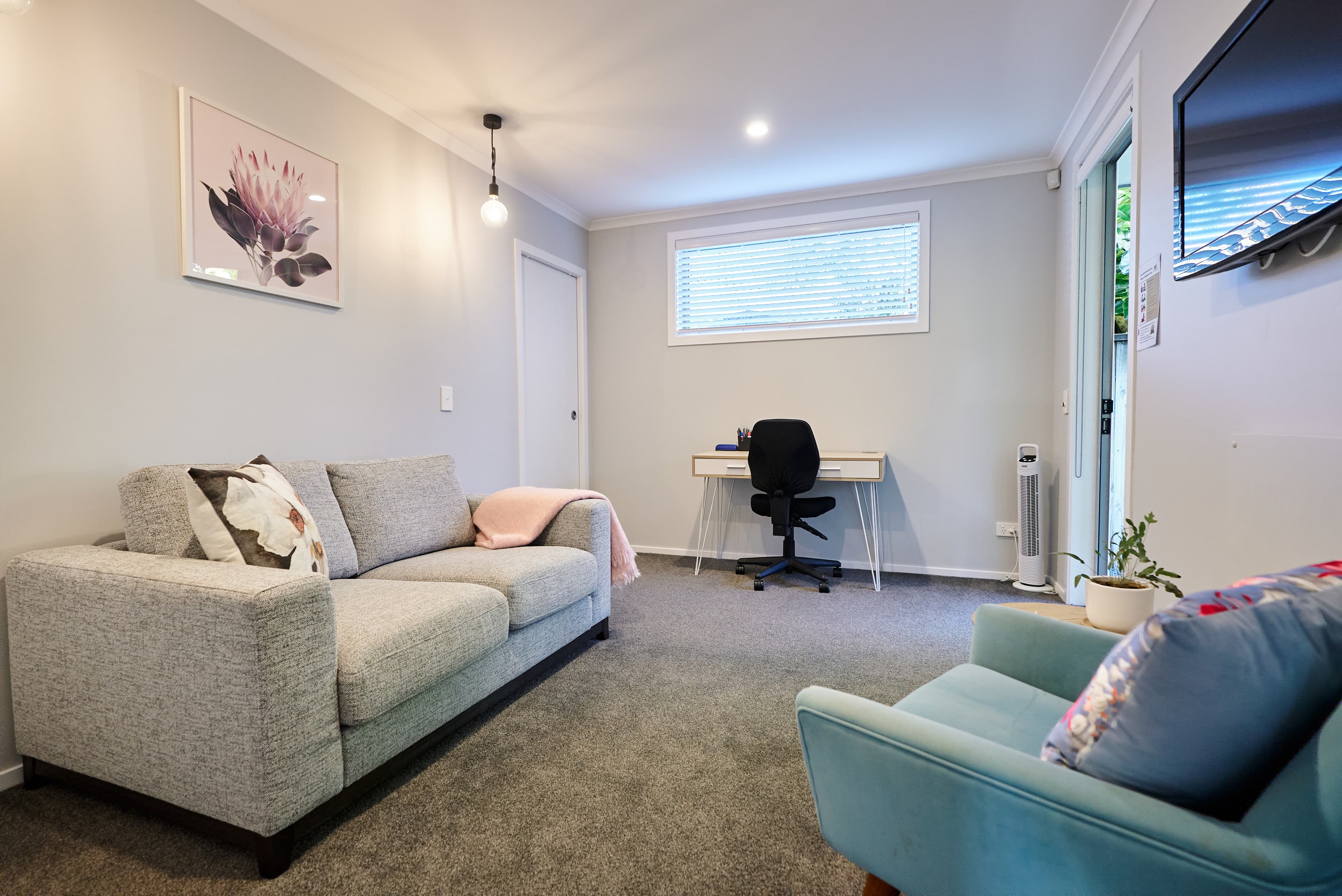 Peaceful counselling room at Papamoa Counselling Hub with comfortable seating - calm and nurturing space for therapy sessions